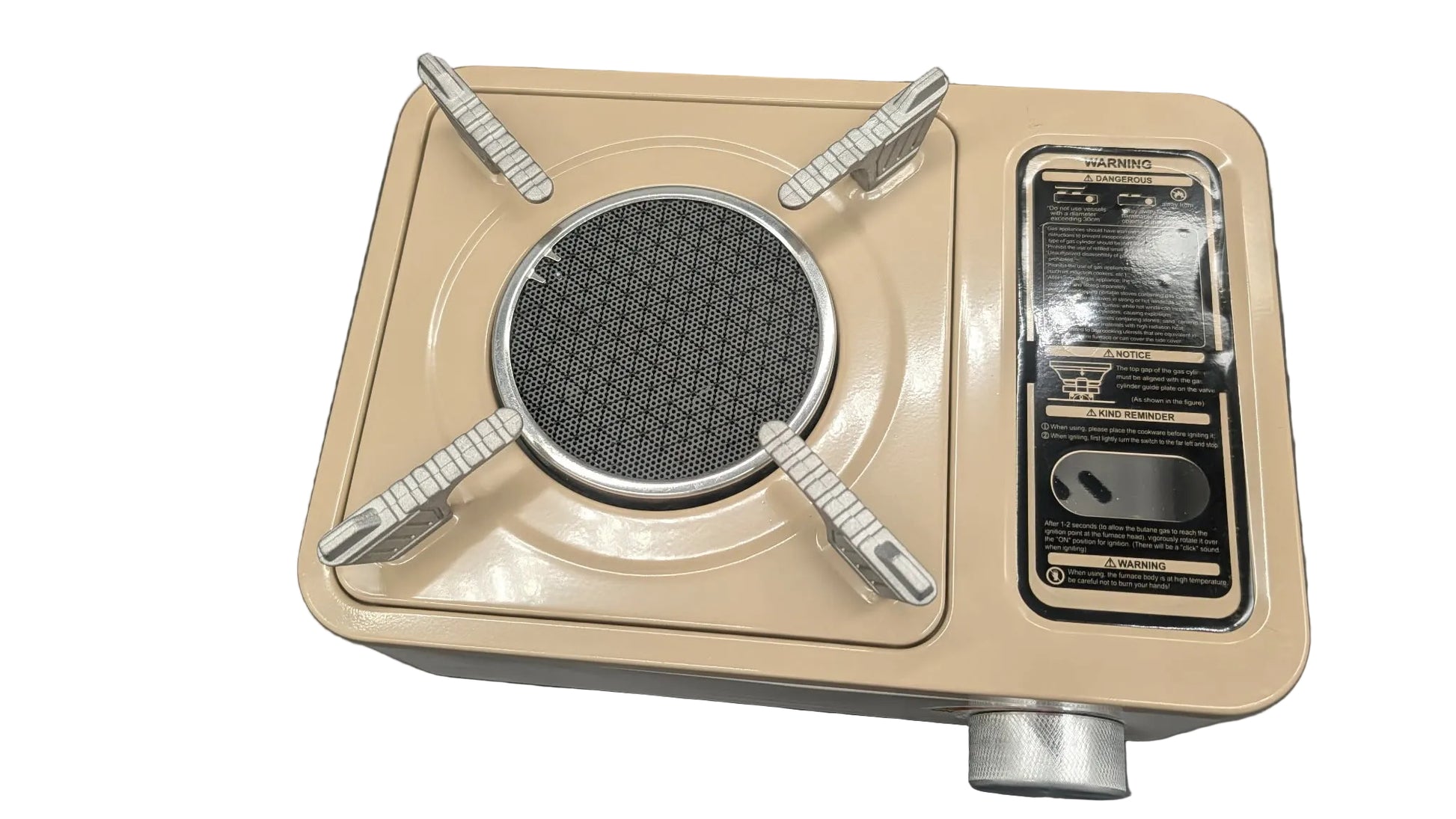 A vintage-style portable gas stove with a beige metal body, silver metal burner grates, and a black information and warning panel on the right side, photographed on a white surface.